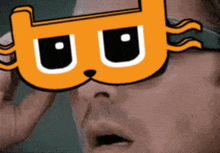 a close up of a person wearing a cat mask with the letter b on it