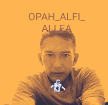 a man in a pink shirt with the name opah_alfi_allea on the bottom
