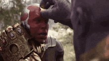 a close up of a person with a glove on their head
