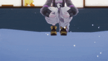 a person sitting on a snowy surface with their feet in the snow
