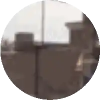 a blurry picture of a room with a lamp and a chair