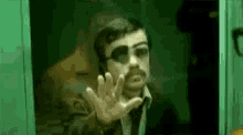 peter dinklage hand on glass eye patch middle finger fuck you