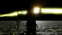 a dark room with a yellow light coming out of the top