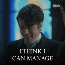 a man in a suit says " i think i can manage " in front of a stained glass window