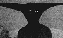 a black and white photo of a person 's face