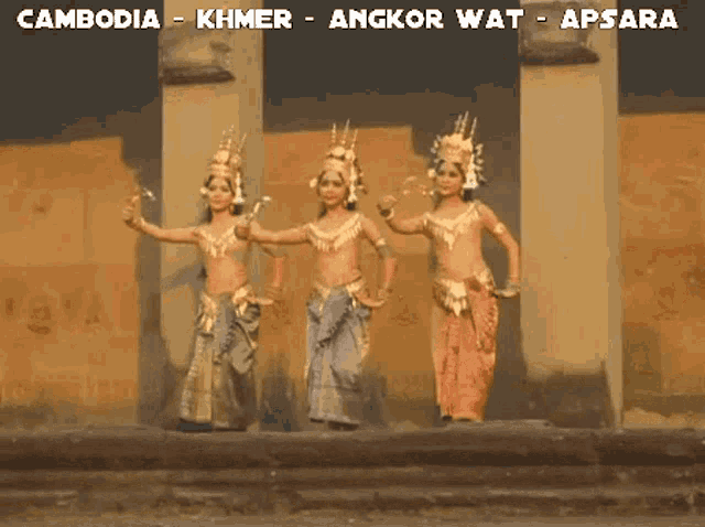three women are dancing in front of a wall with cambodia khmer angkor wat apsara written on the bottom 