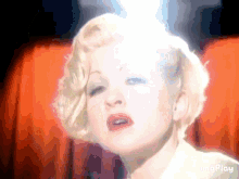 a close up of a woman 's face with the words imgplay below