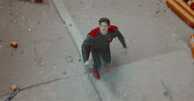 a man in a superman costume says " good gosh there 's gotta be a better way to do this .. "