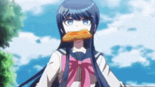 a girl in a sailor uniform is eating a piece of bread .