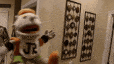 a puppet with jr written on his shirt