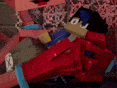 a cartoon character is laying on a pile of bricks