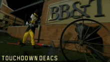 a mascot stands in front of a bb & t sign