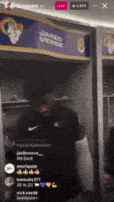 a man in a black shirt is standing in front of a sign that says jared versus