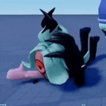 a person is laying on their back on the ground in a video game while another person stands behind them .