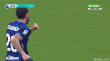 a soccer player is celebrating a goal during a game