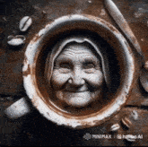 an old woman 's face is carved into the inside of a coffee cup