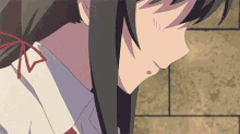 a close up of a girl 's face with long black hair and a red tie .