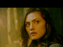 a close up of a woman 's face with a blurred background