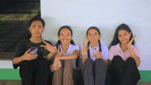 a group of young people are posing for a picture