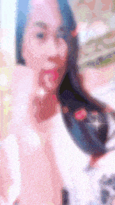 a blurry picture of a woman with long hair