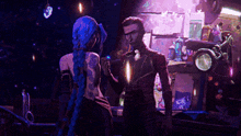 a man and a woman standing next to each other in a dark room .