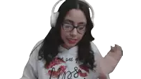 a woman wearing headphones and a hoodie that says miss