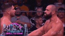 two men in a wrestling ring with the words still to come on the screen