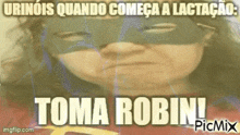 a picture of a woman wearing a mask with the words toma robin on the bottom