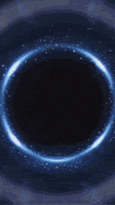 a dark background with a blue circle in the middle of it
