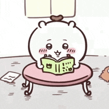 a cartoon of a bear reading a book while sitting on a table .