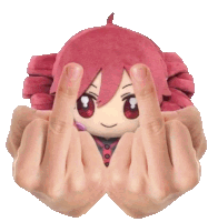 a person is holding a stuffed doll with their middle fingers up