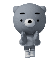 a gray teddy bear wearing a sweater and shorts is clapping his hands