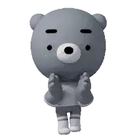 a gray teddy bear wearing a sweater and shorts is clapping his hands