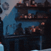 a woman stands in a kitchen with a bottle of milk in front of a sink