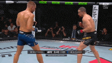 two men are fighting in a boxing ring and the ufc fight pass is shown