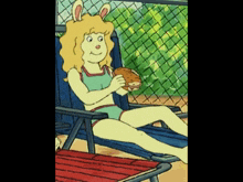 a cartoon character sitting in a chair holding a sandwich