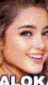 a close up of a woman 's face with the word alok on the bottom right