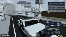 a screenshot of a video game shows a police car driving down the road