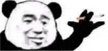 a panda bear is holding a cigarette in his hand and waving .
