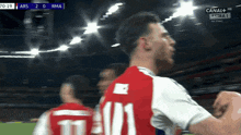 a soccer player with the number 11 on his shirt