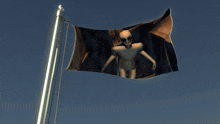 a pirate flag with an alien on it is flying in the wind