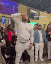 a man is dancing in front of a crowd with the hashtag stevedastoner414b on the bottom