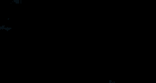 a close up of a snowflake on a dark background .