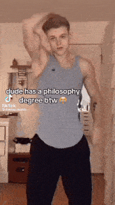 a man in a blue tank top has a philosophy degree btw