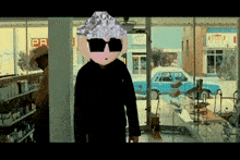 a man wearing sunglasses and a hat stands in front of a store with a sign that says ' pr ' on it