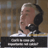 a man wearing headphones with the words cos 'e la cosa più importante nel calcio