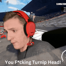 a man wearing red headphones with the words you f * cking turnip head on the bottom
