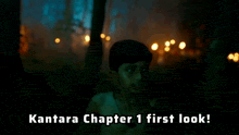 a boy in a dark forest with the words kantara chapter 1 first look below him