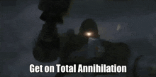 a close up of a person holding a gun with the words `` get on total annihilation '' written on the bottom .