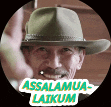 a man wearing a cowboy hat has a sticker that says assalamua-laikam on it